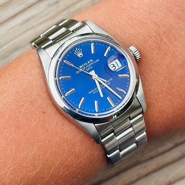Rolex Oyster Perpetual Date with blue dial on the wrist